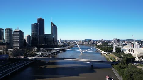 brisbane city skyscrapers towering over the brisbane riverside expressway and connecting bridges