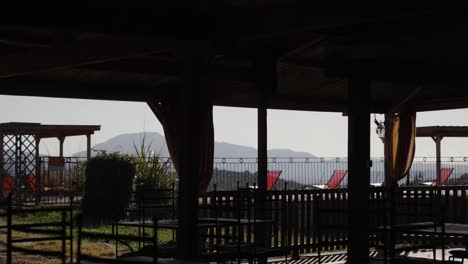 lounging balcony area with sun chairs and a nicely decorated yard, near the pic saint-loup, one of the most famous vineyards of the languedoc, france