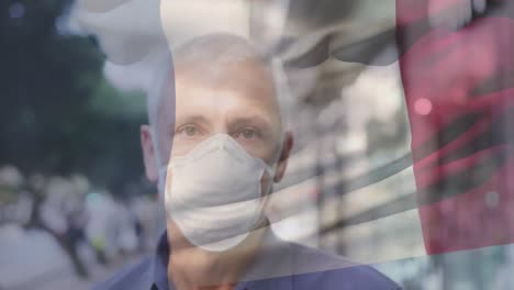 Animación-De-La-Bandera-De-Francia-Ondeando-Sobre-Un-Hombre-Con-Mascarillas.