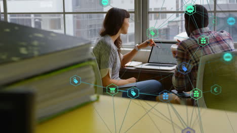 Animation of network of connections with icons over diverse businesspeople