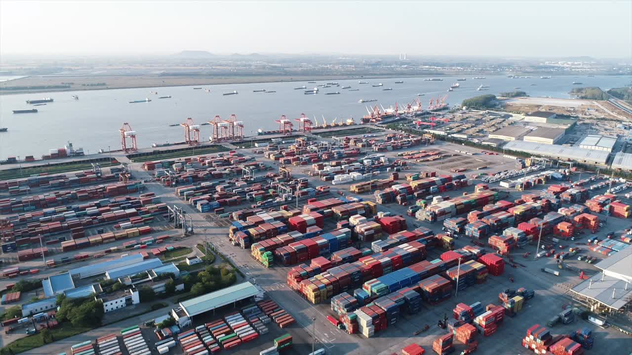 Overhead view of trucks shuttling among container clusters