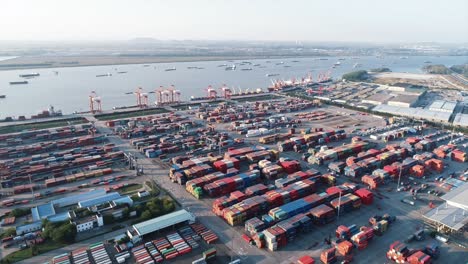 overhead view of trucks shuttling among container clusters