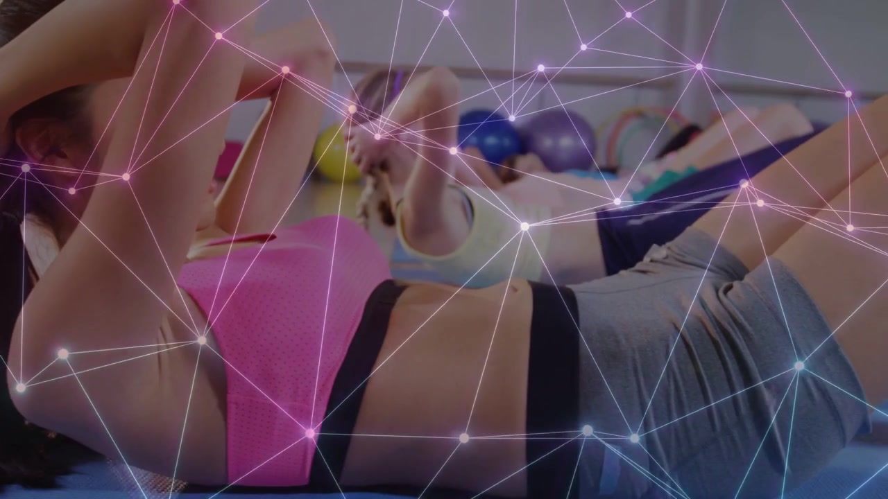 Foreground woman starting crunches on cue, leading fitness class on blue mats, overlay mapping core