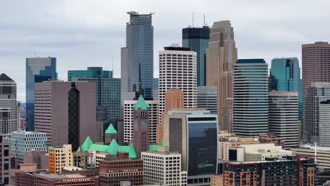 a vibrant view of the minneapolis skyline with modern skyscrapers and historic architecture