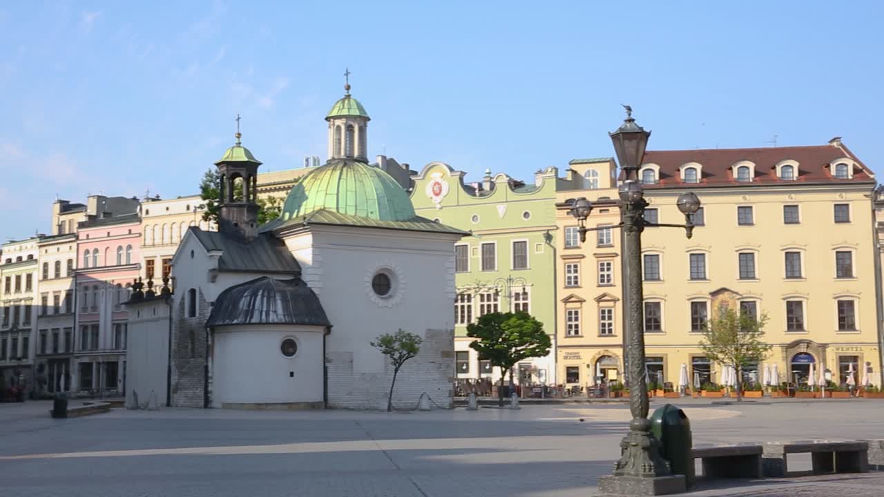 Krakow Main Square panorama, colorful townhouses and St. Adalbert Church