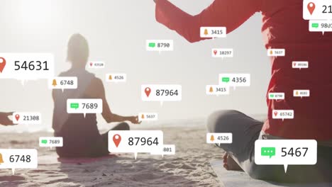 Animation-of-social-media-notifications,-over-women-doing-yoga-sitting-on-beach