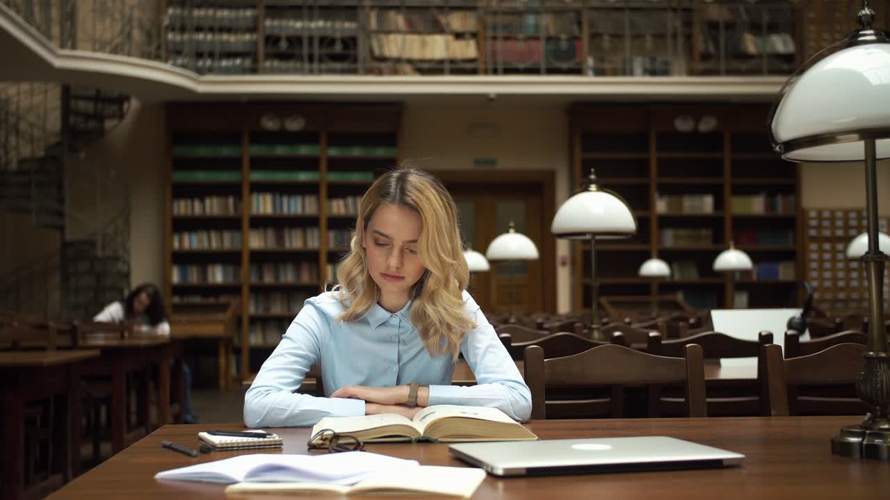 Woman Studying in Library