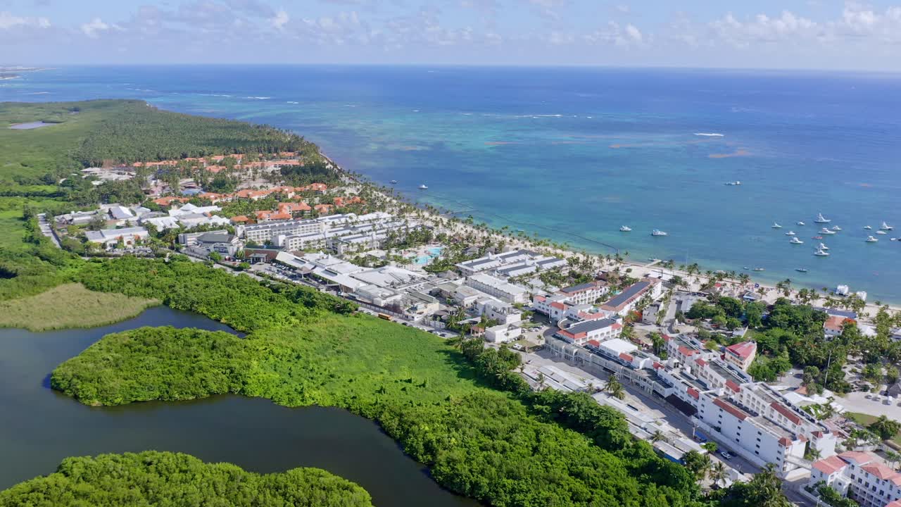 drone panoramic view of beautiful laguna bavaro green wildlife refuge with  boats and resorts in punta cana, dominican republic