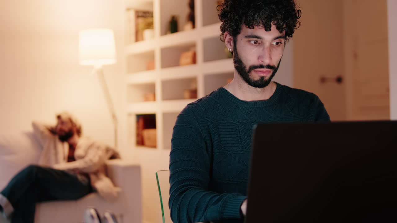 Gay Couple at Home: Working and Relaxing