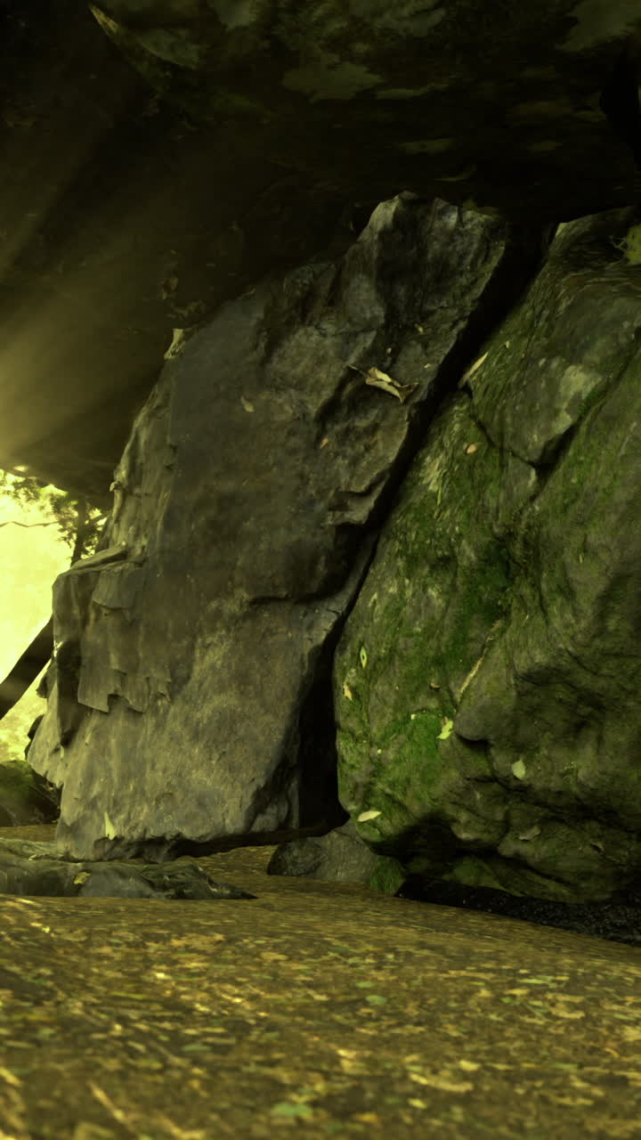 Light streams through a rocky cave revealing a serene outdoor view