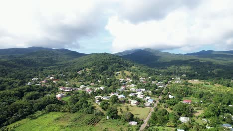 settlements with lush mountain ridge in the background in guadeloupe, france