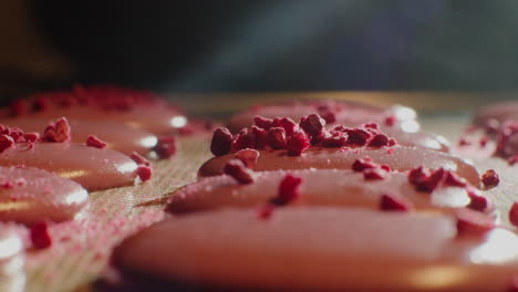 pink macarons with raspberry topping