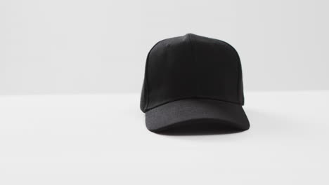 video of black baseball cap and copy space on white background