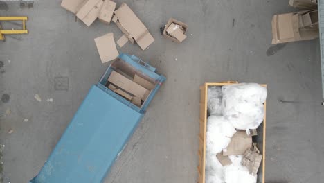 overfilled skip containers for cardboard and plastic waste at business park in dublin, ireland