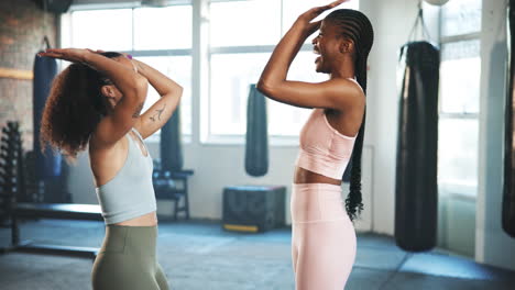 Women,-fitness-and-high-five-in-gym-for-training
