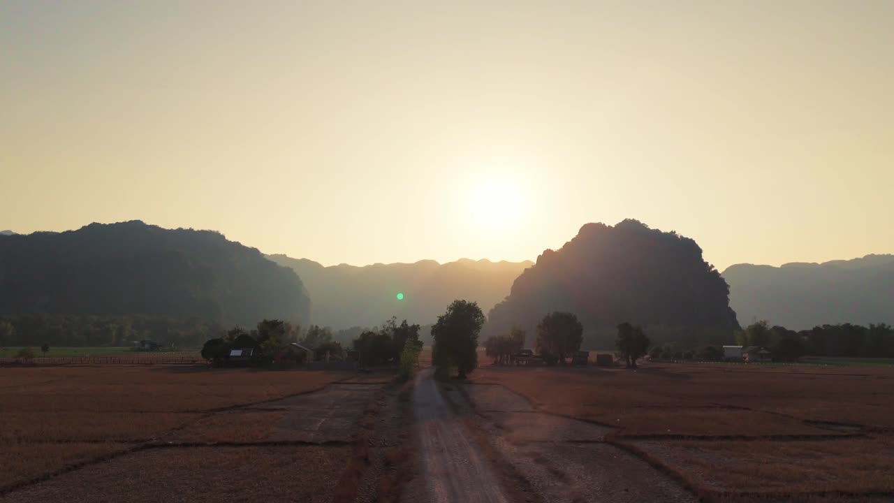Motorcycle off road scenic riding at sunset in limestone landscape in Laos famous Thakhek loop motorcycle Asia aerial drone
