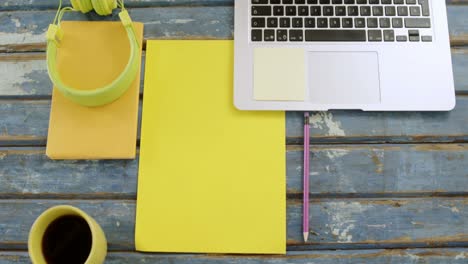 headphones, organizer, pencil, coffee and laptop on table 4k