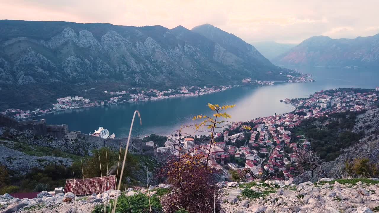 Kotor city and bay from top of the mountain. Breathtaking aerial view. Static shot.