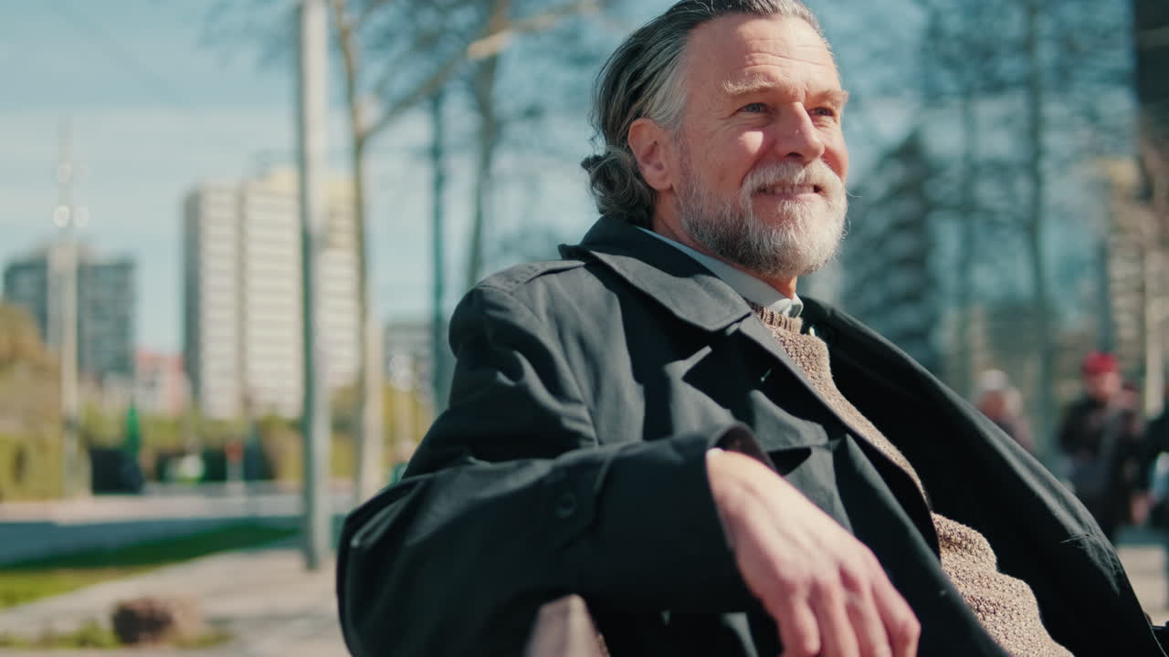 Happy Senior Man Relaxing in a City Park