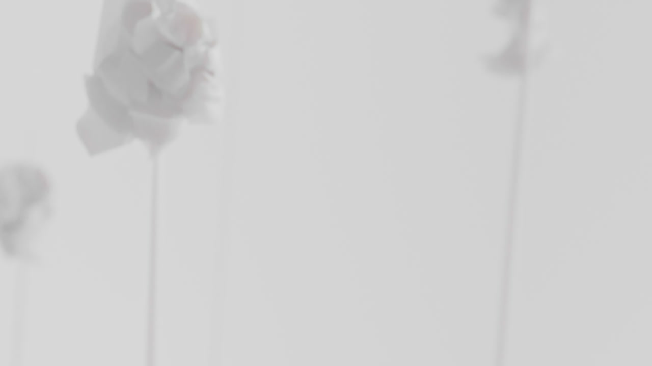 Crushed android heads on spikes in white space