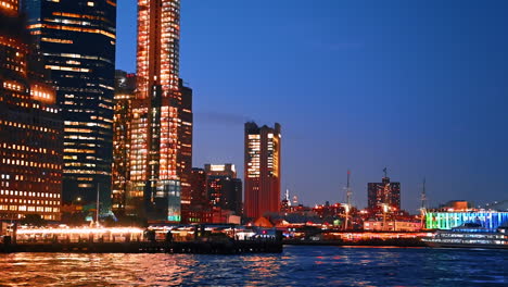 travelling on boat by the east river at night. admiring fantastic illumination of beautiful new york, usa
