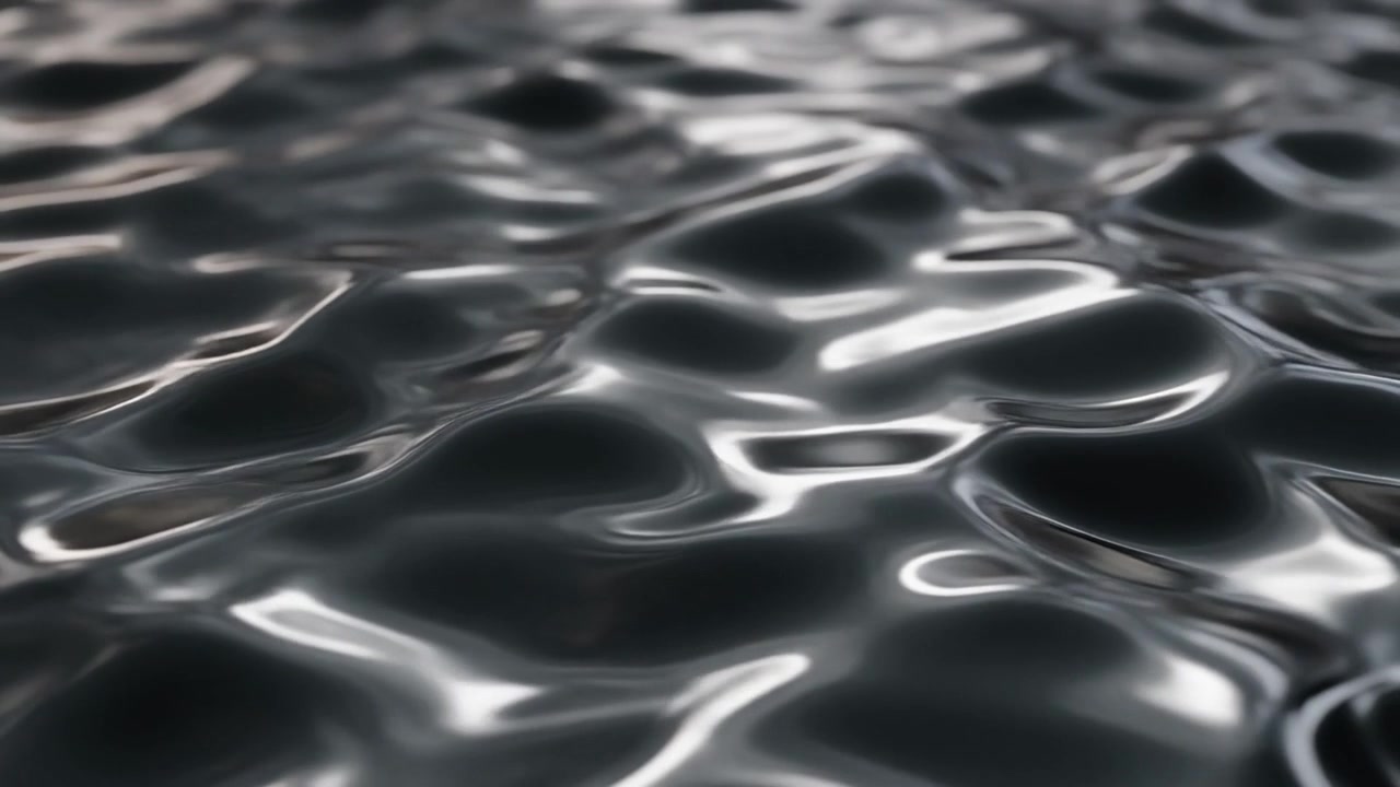 Superficie liquida scura astratta con leggere increspature.