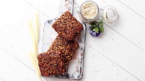 closeup of whole grain bread with sunflower seeds on a rustic wooden board