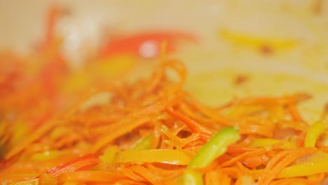 shredded carrots cooking in a bowl