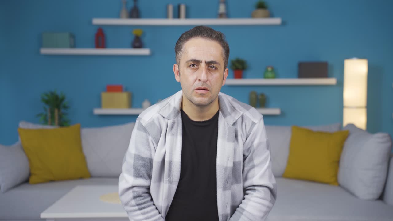 Man looking at camera with curious expression.