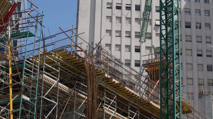Captivating Footage Revealing a Fixed Construction Plan in Action, Featuring the Graceful Movement of a Crane