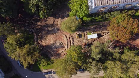 aerial view of construction site near post-soviet residential buildings