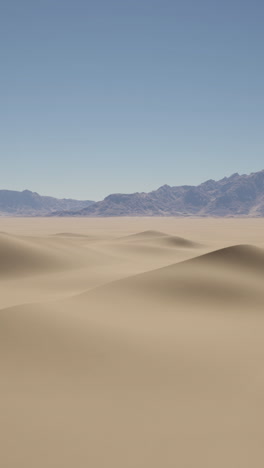 desert landscape with sand dunes and mountains