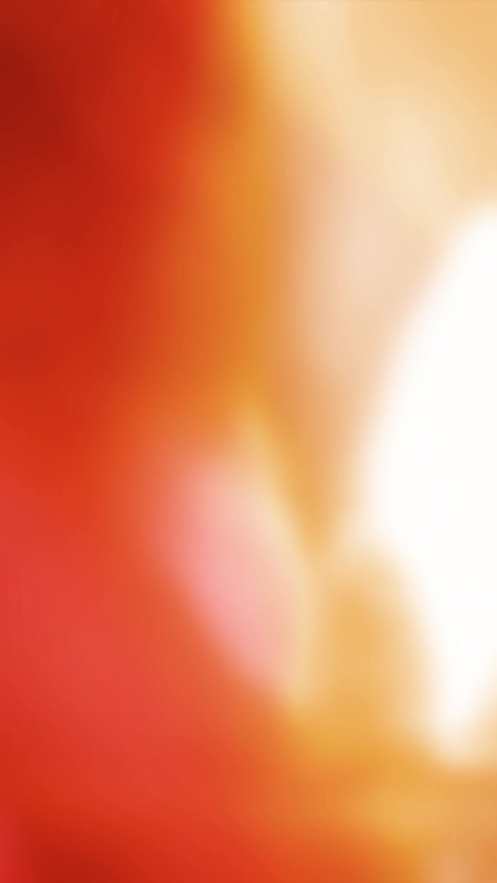 Dynamic Red and Orange Light Leaks on a Dark Background