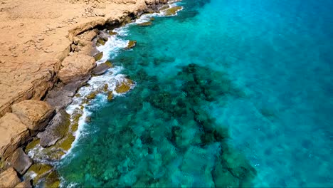 crystal clear turquoise blue water at sea caves ayia napa cyprus view