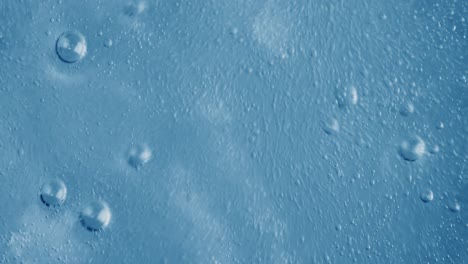 oxygen bubbles in water on a blue abstract background