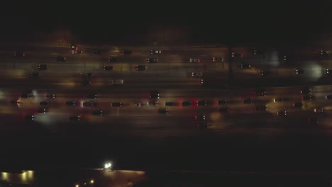 Birds-Eye-Overhead-Top-Down-Shot-of-Highway-traffic-at-night-on-Los-Angeles-freeway