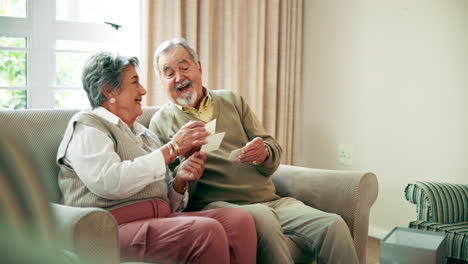 Senior Couple Looking at Photographs
