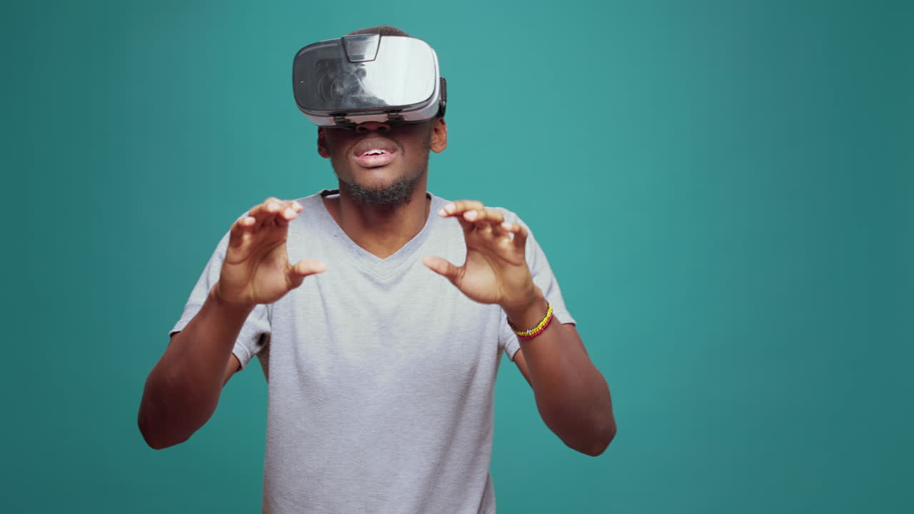 Modern adult having fun with vr glasses game on camera