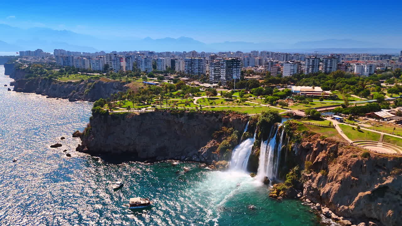 Stunning green park zone at the rugged rocky shore of the Mediterranean Sea. Aerial perspective on the beautiful Duden Waterfalls in Antalya Province, southern Turkey