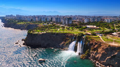 stunning green park zone at the rugged rocky shore of the mediterranean sea. aerial perspective on the beautiful duden waterfalls in antalya province, southern turkey