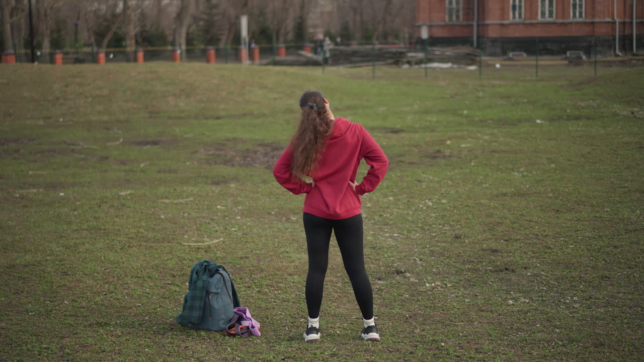 Calm Woman Observing, Quiet Female Examines Distant View, Serene Lady Surveys Horizon With Hands On Hips, Relaxed Female Individual Checks Out Scenic View With Attentive Focus And Readiness