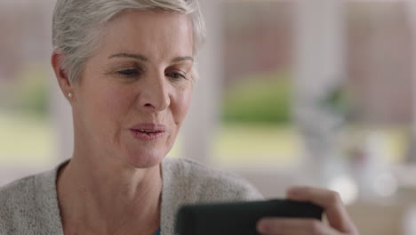 happy-mature-woman-having-video-chat-using-smartphone-grandmother-enjoying-conversation-with-family-sharing-lifestyle-chatting-on-mobile-phone-to-grandchildren-relaxing-at-home-4k