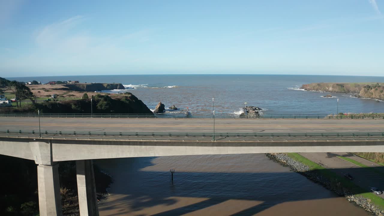 Aerial close-up dolly shot along the Noyo River Bridge in Fort Bragg, California. 4K