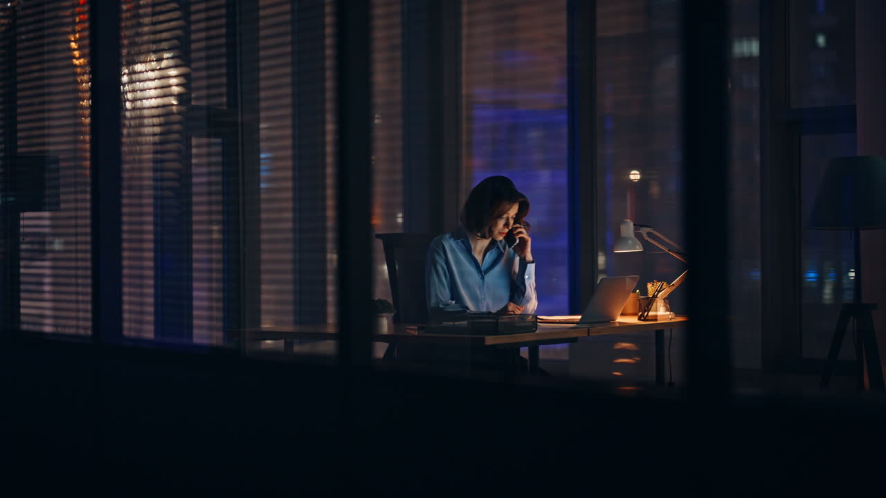 Businesswoman arguing smartphone night workplace. Nervous woman complaining