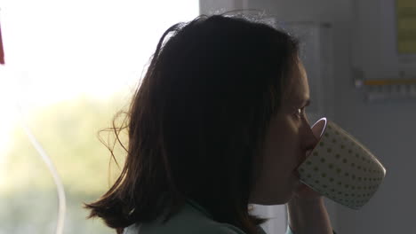 young woman drink and eating hospital food, indoors motion view