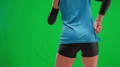 woman in volleyball uniform on green screen