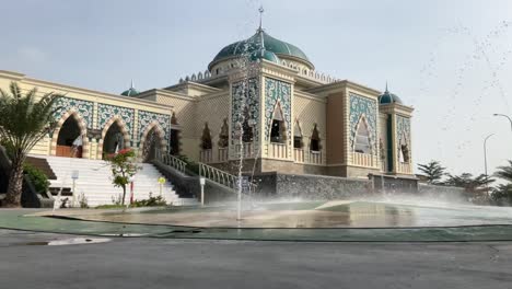 magnificent and beautiful mosque with a fountain in the courtyard