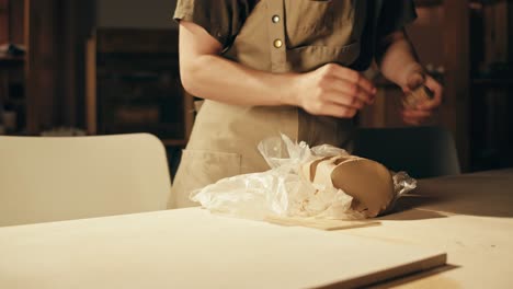 woman working on pottery project