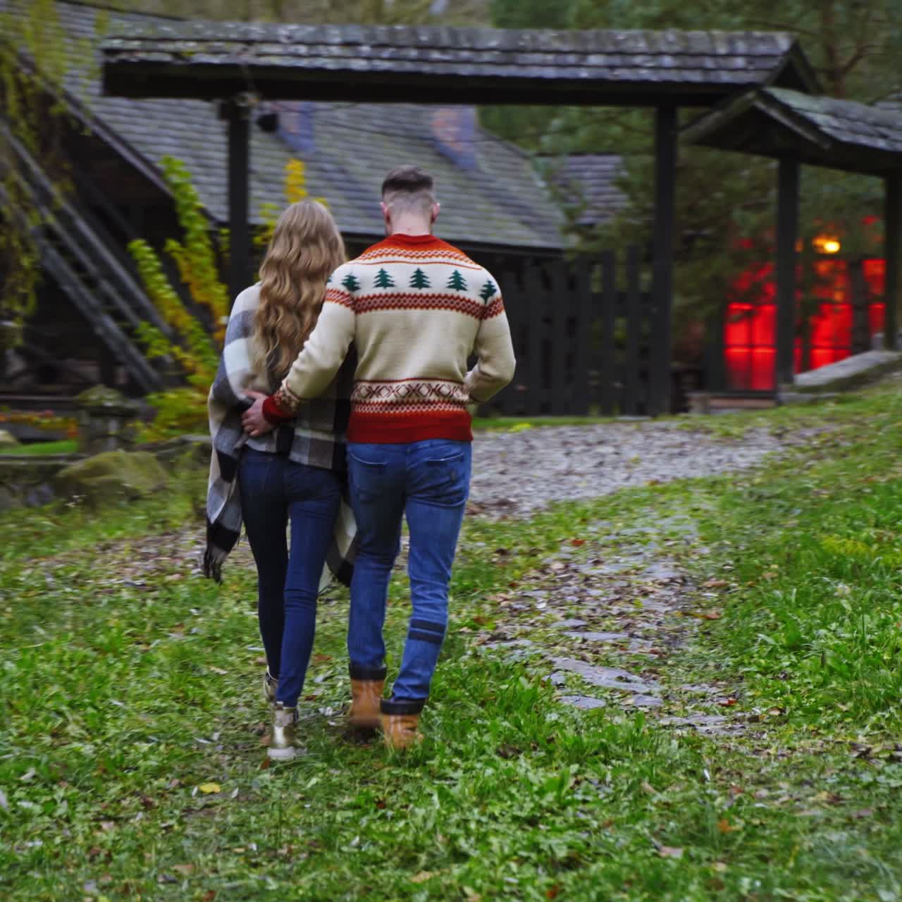 Romantic couple walk outside hugging each other. Autumn nature background. View from the back. Love story video