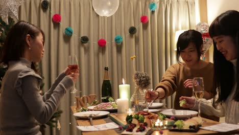 japanese girls enjoying christmas dishes